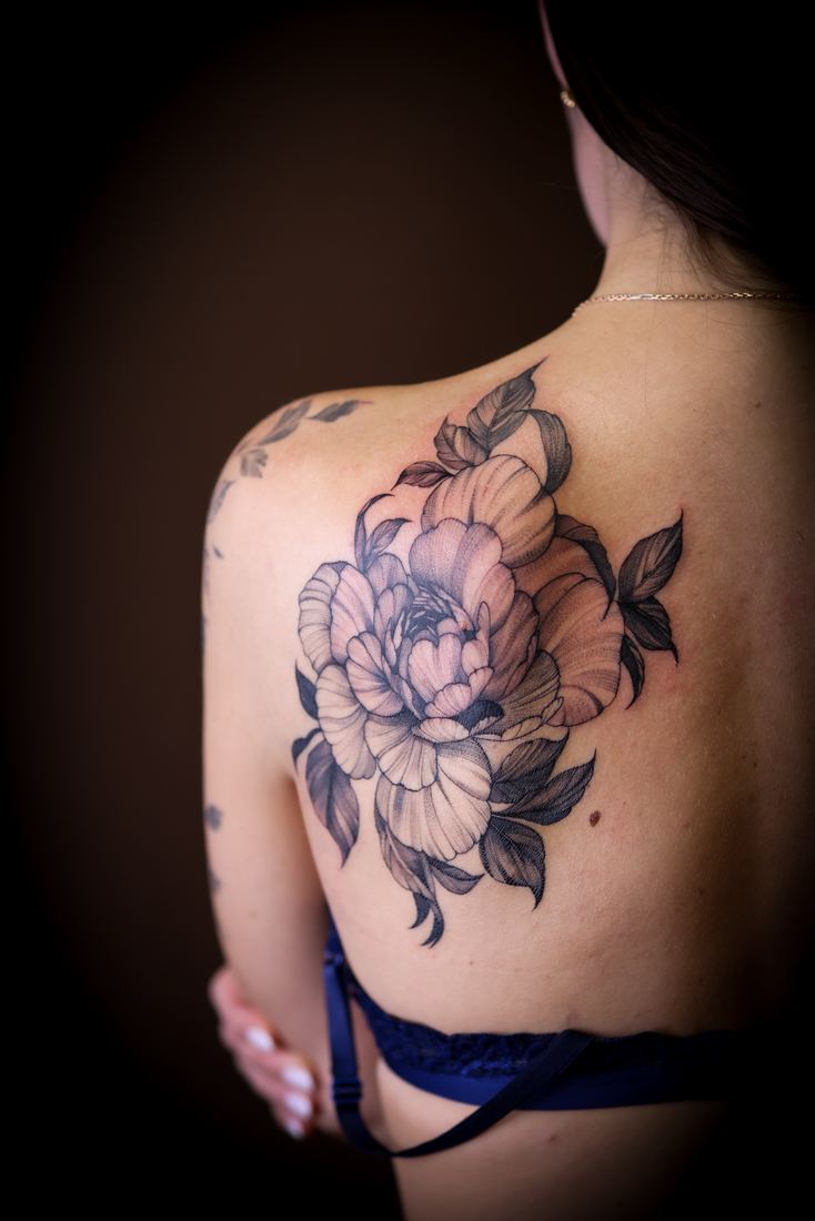 Peony on the shoulder blade